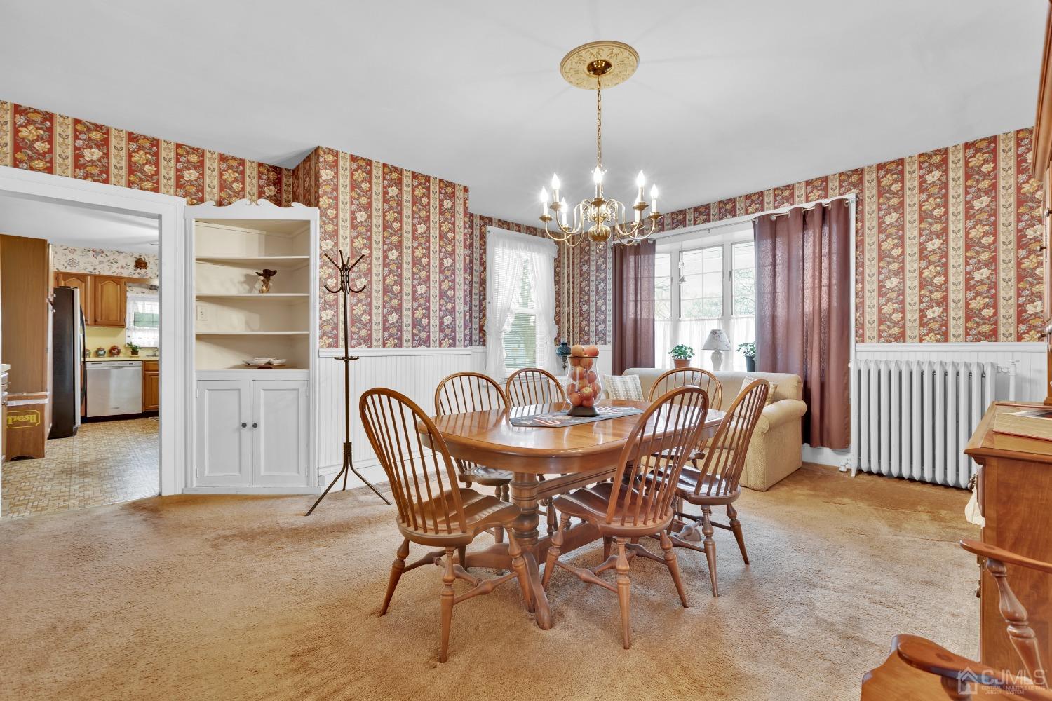 184 Creek Road Keansburg, NJ 07734 - Photo 7 of 29 a view of a dining room with furniture and chandelier