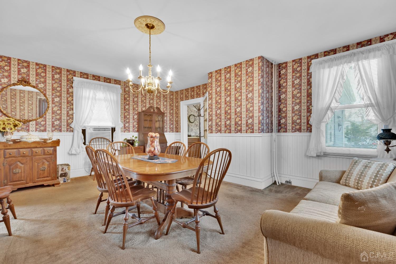 184 Creek Road Keansburg, NJ 07734 - Photo 8 of 29 a view of a dining room with furniture and chandelier