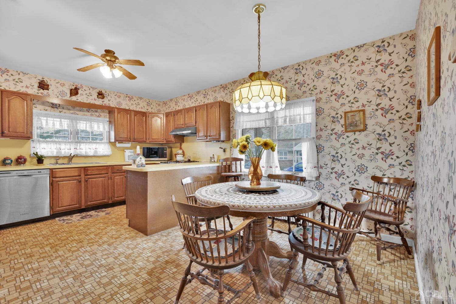 184 Creek Road Keansburg, NJ 07734 - Photo 9 of 29 a kitchen with a table and chairs in it