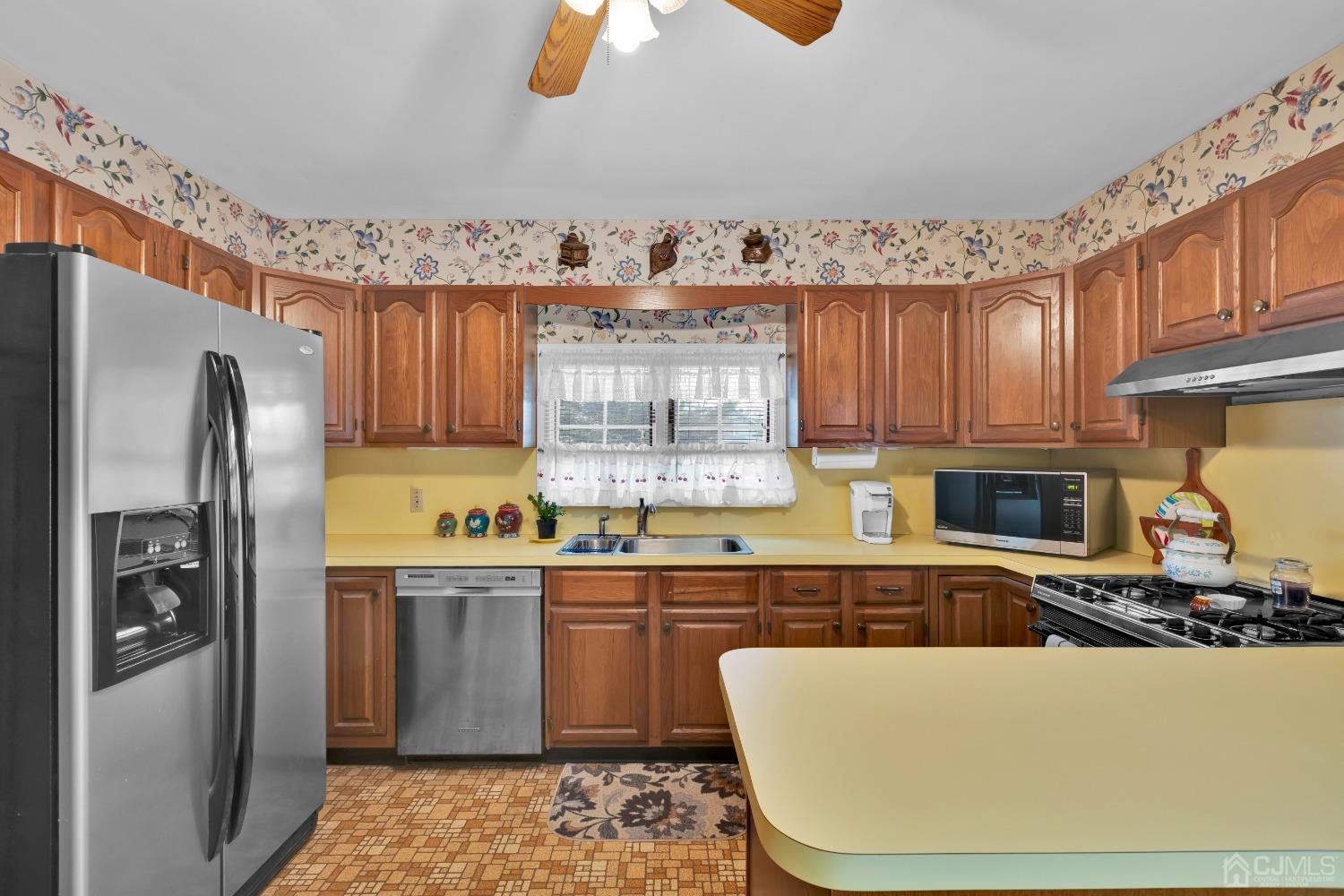 184 Creek Road Keansburg, NJ 07734 - Photo 10 of 29 a kitchen with stainless steel appliances granite countertop a refrigerator a stove top oven a sink and dishwasher