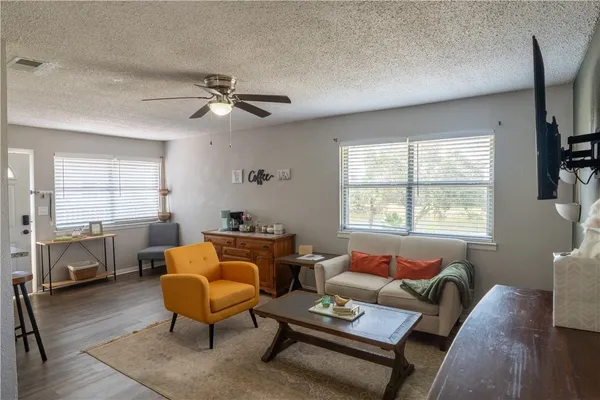 a living room with furniture and a window