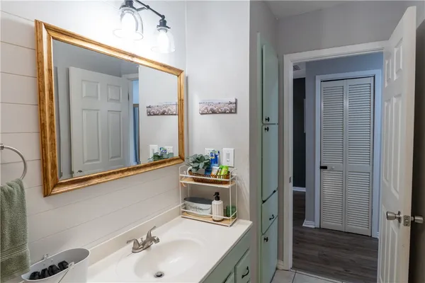 a bathroom with a sink and a mirror
