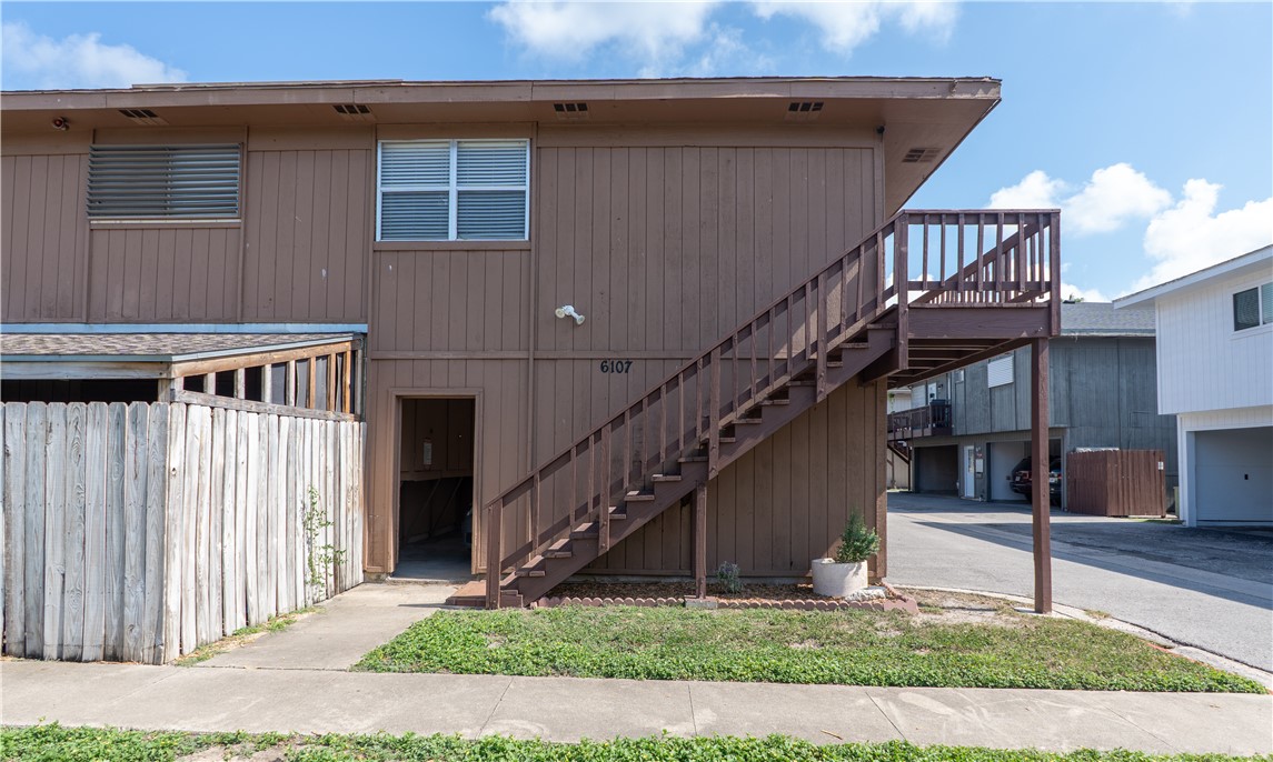 6107 Hidden Wood Corpus Christi, TX 78412 - Photo 9 of 9 a front view of a house with wooden stairs