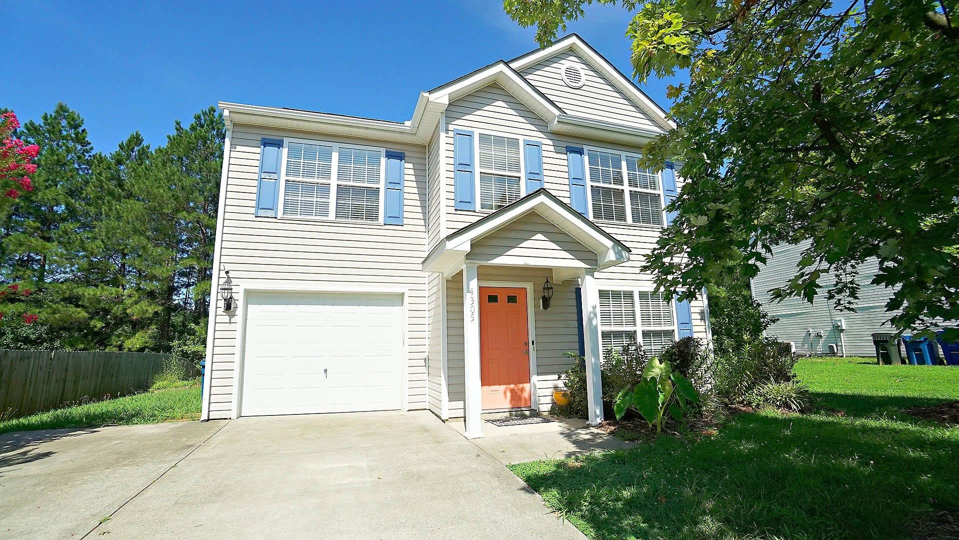 4305 Chimney Stone Road Durham, NC 27704 - Photo 1 of 21 a front view of a house with a yard