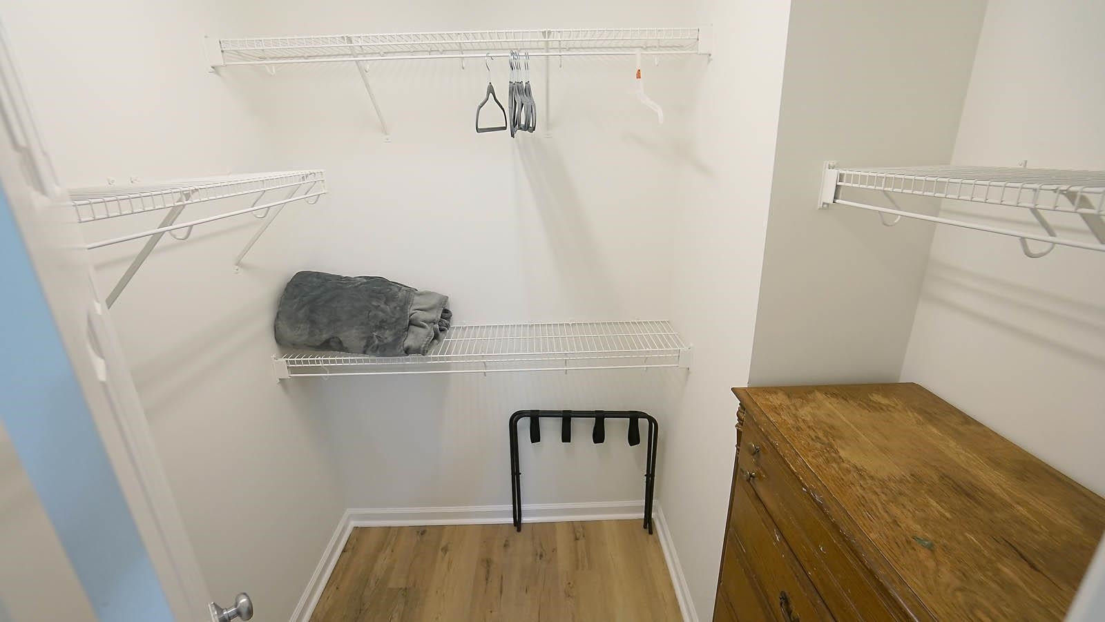 4305 Chimney Stone Road Durham, NC 27704 - Photo 17 of 21 a view of storage and utility room with racks on the wall