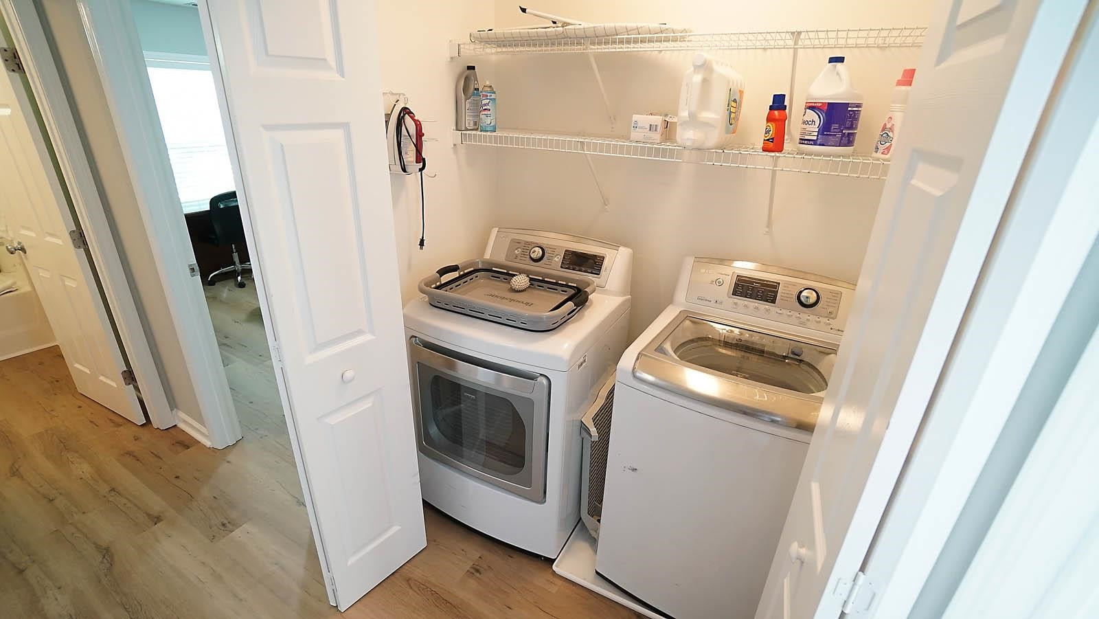 4305 Chimney Stone Road Durham, NC 27704 - Photo 19 of 21 a utility room with dryer and washer