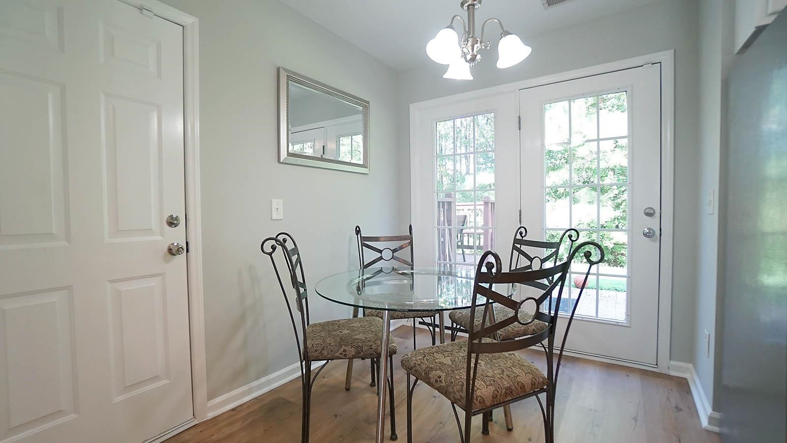 4305 Chimney Stone Road Durham, NC 27704 - Photo 7 of 21 a view of a dining room with furniture window and wooden floor