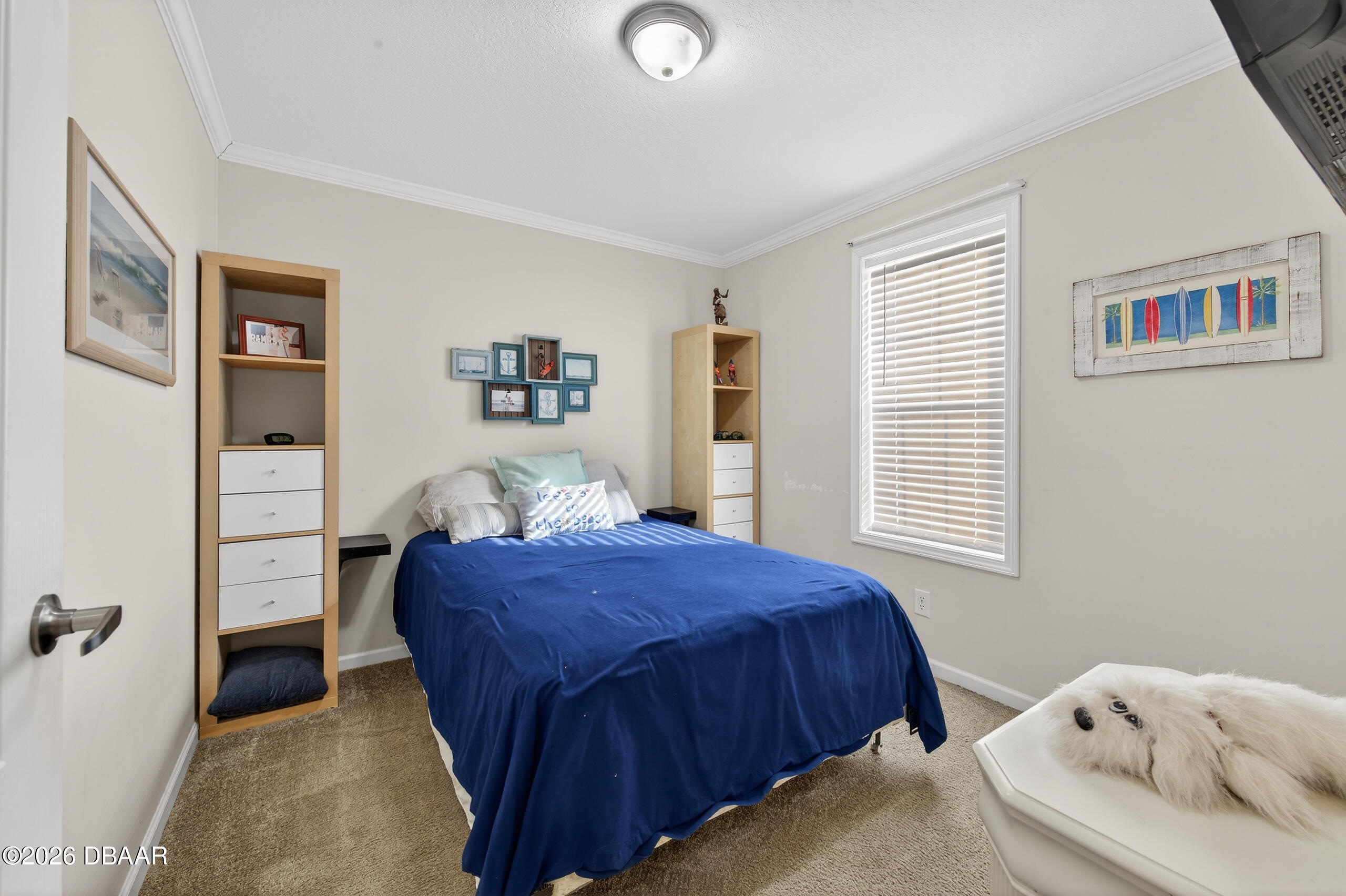 56320 Cherry Tree Road Astor, FL 32102 - Photo 16 of 39 a bedroom with a bed and a dresser