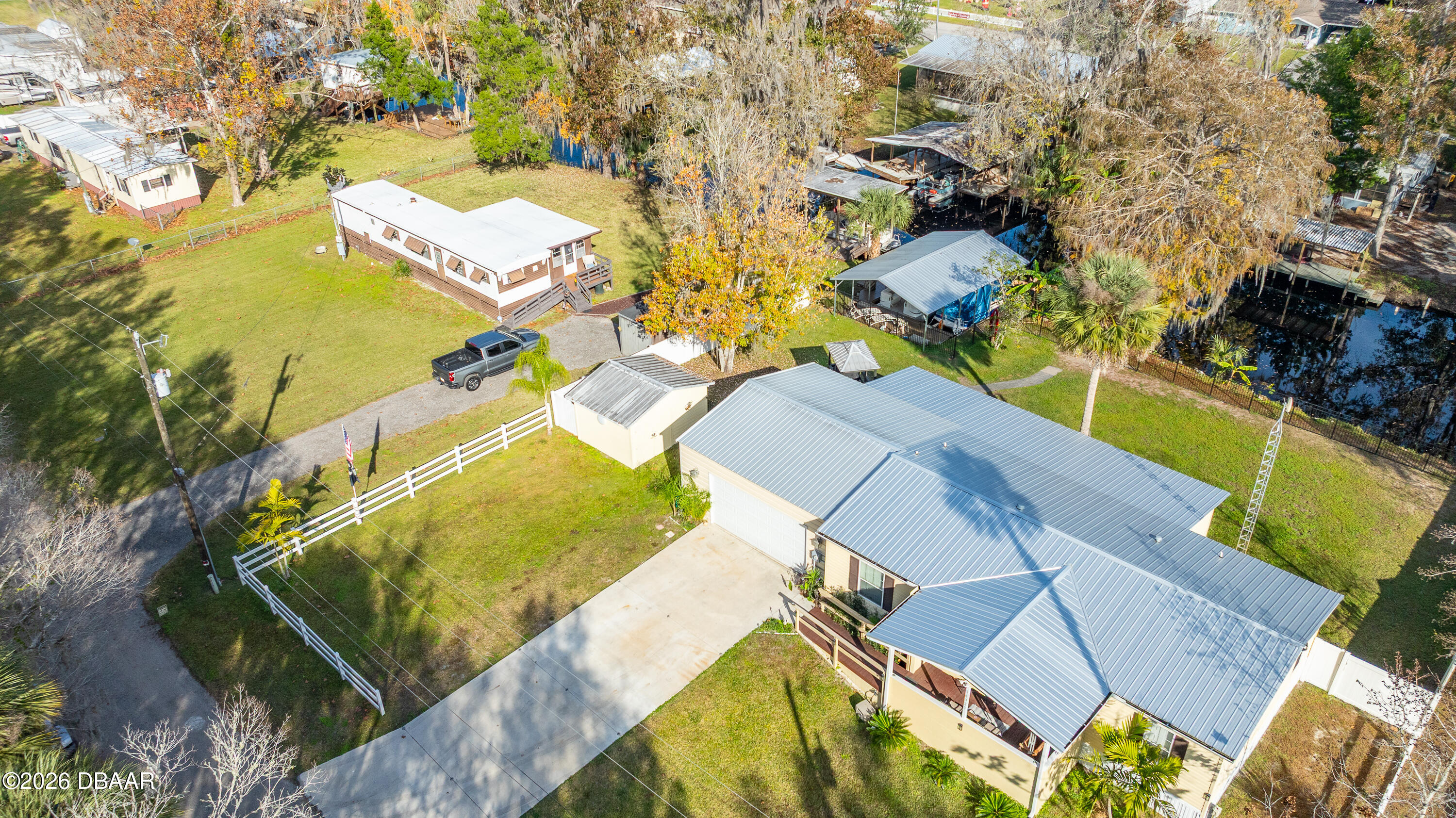 56320 Cherry Tree Road Astor, FL 32102 - Photo 18 of 39 an aerial view of residential houses with outdoor space