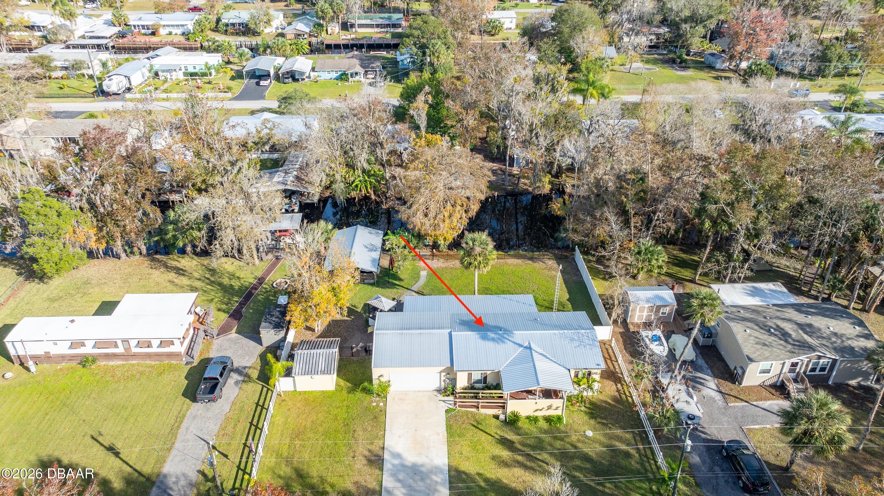 56320 Cherry Tree Road Astor, FL 32102 - Photo 20 of 39 an aerial view of a house with a lake view