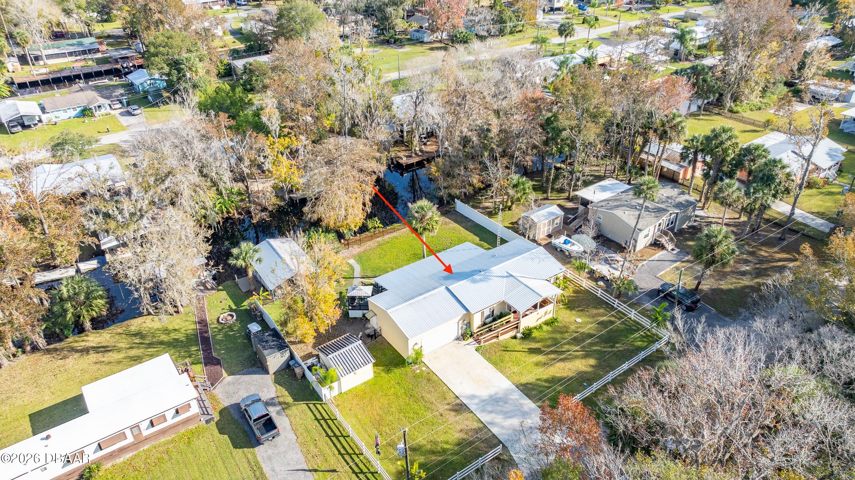 56320 Cherry Tree Road Astor, FL 32102 - Photo 21 of 39 an aerial view of a house with a swimming pool and outdoor seating