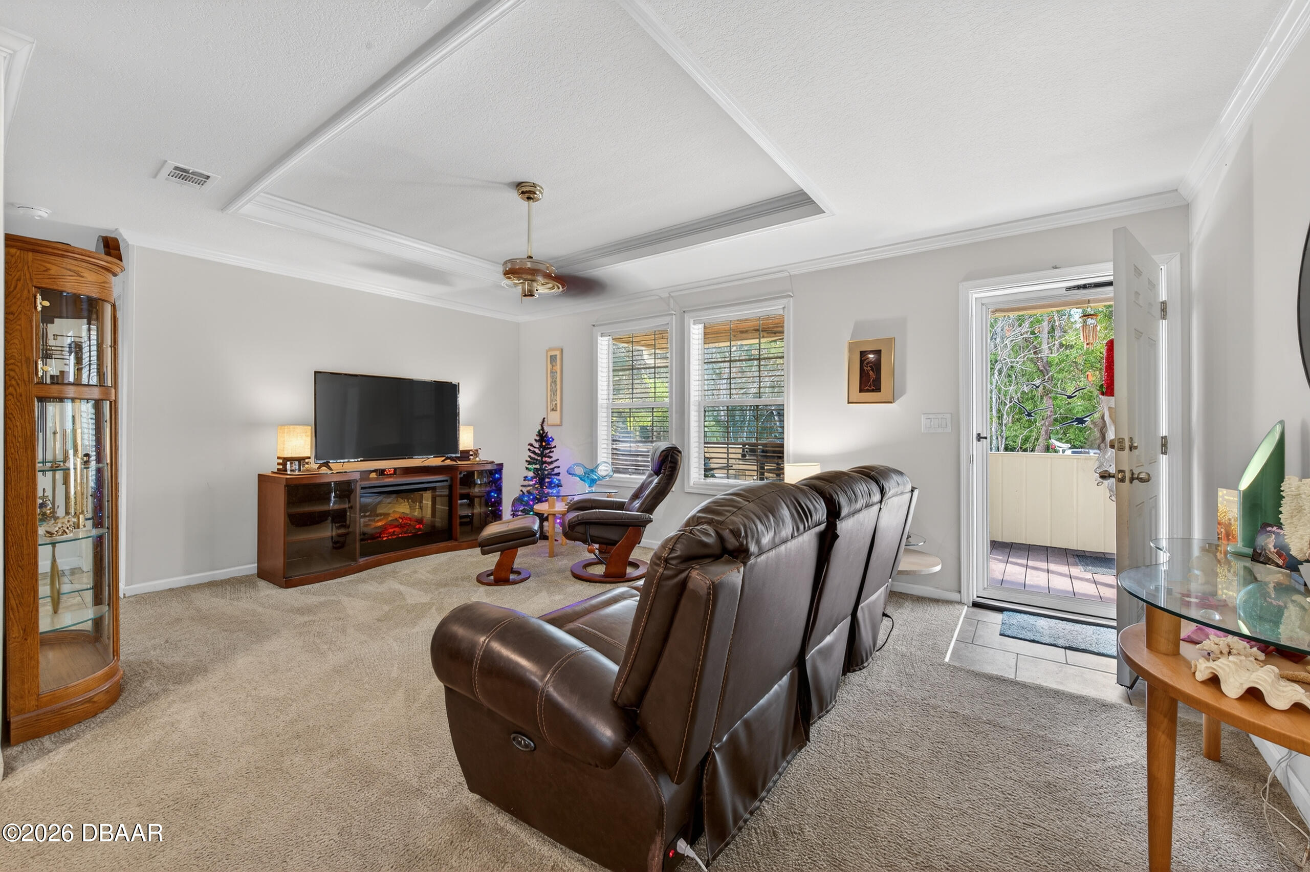 56320 Cherry Tree Road Astor, FL 32102 - Photo 7 of 39 a living room with furniture a flat screen tv and a window