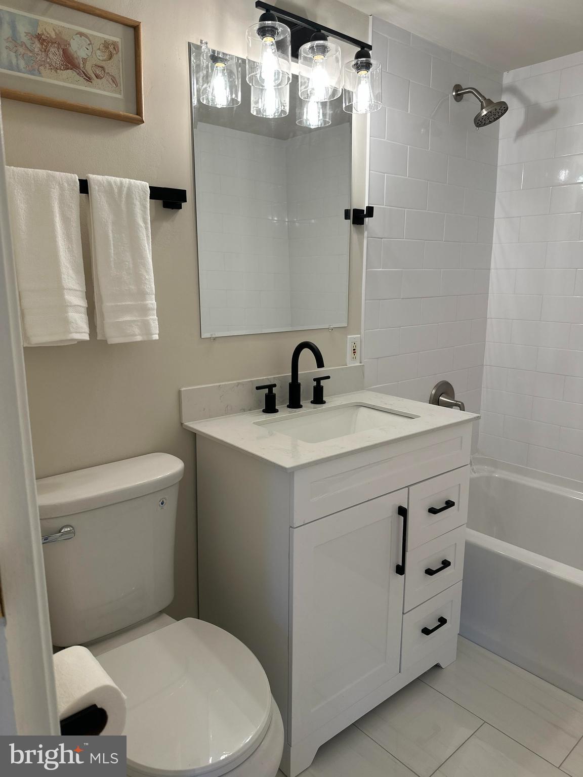 2317 Freetown Court, Unit 11C Reston, VA 20191 - Photo 11 of 21 a bathroom with a sink a toilet and shower