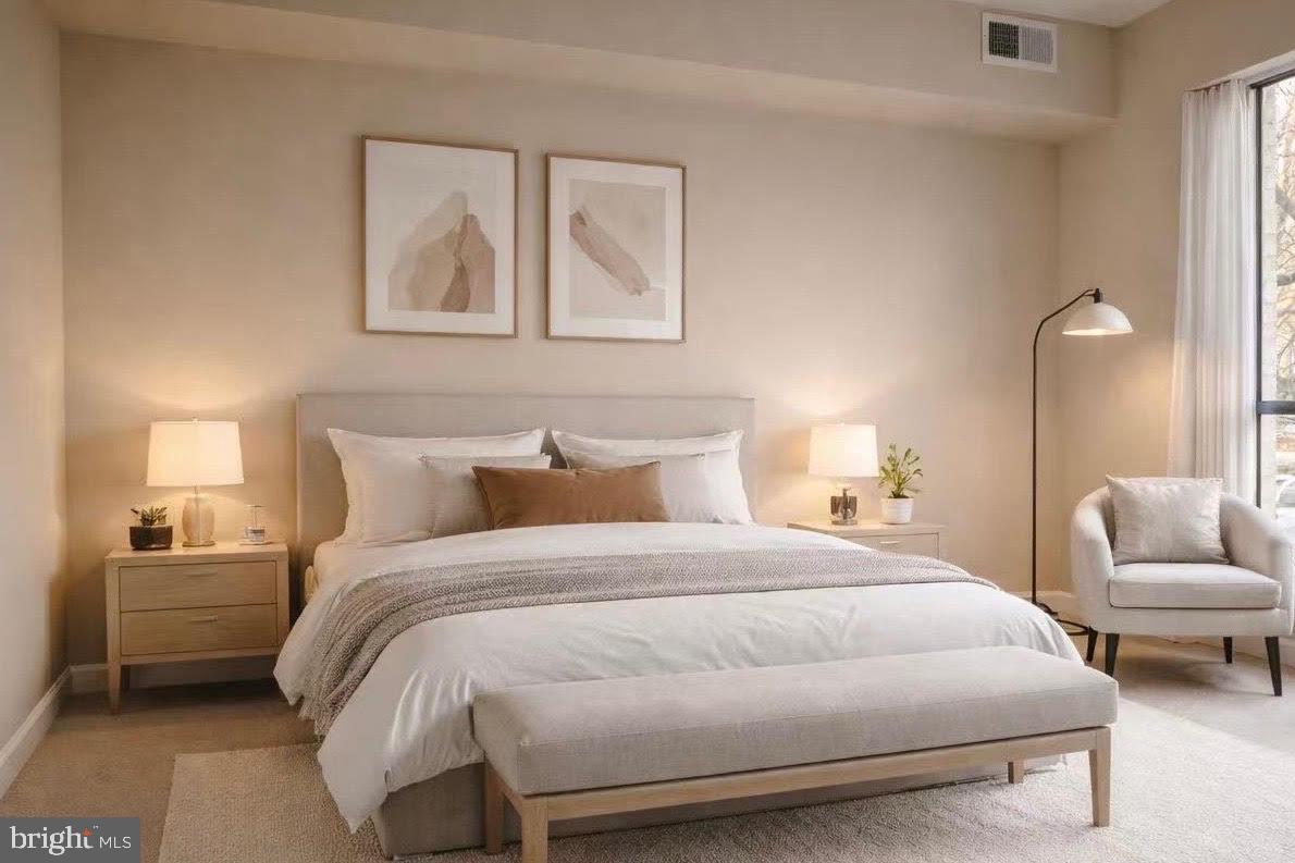 2317 Freetown Court, Unit 11C Reston, VA 20191 - Photo 14 of 21 a bedroom with a bed and a couch