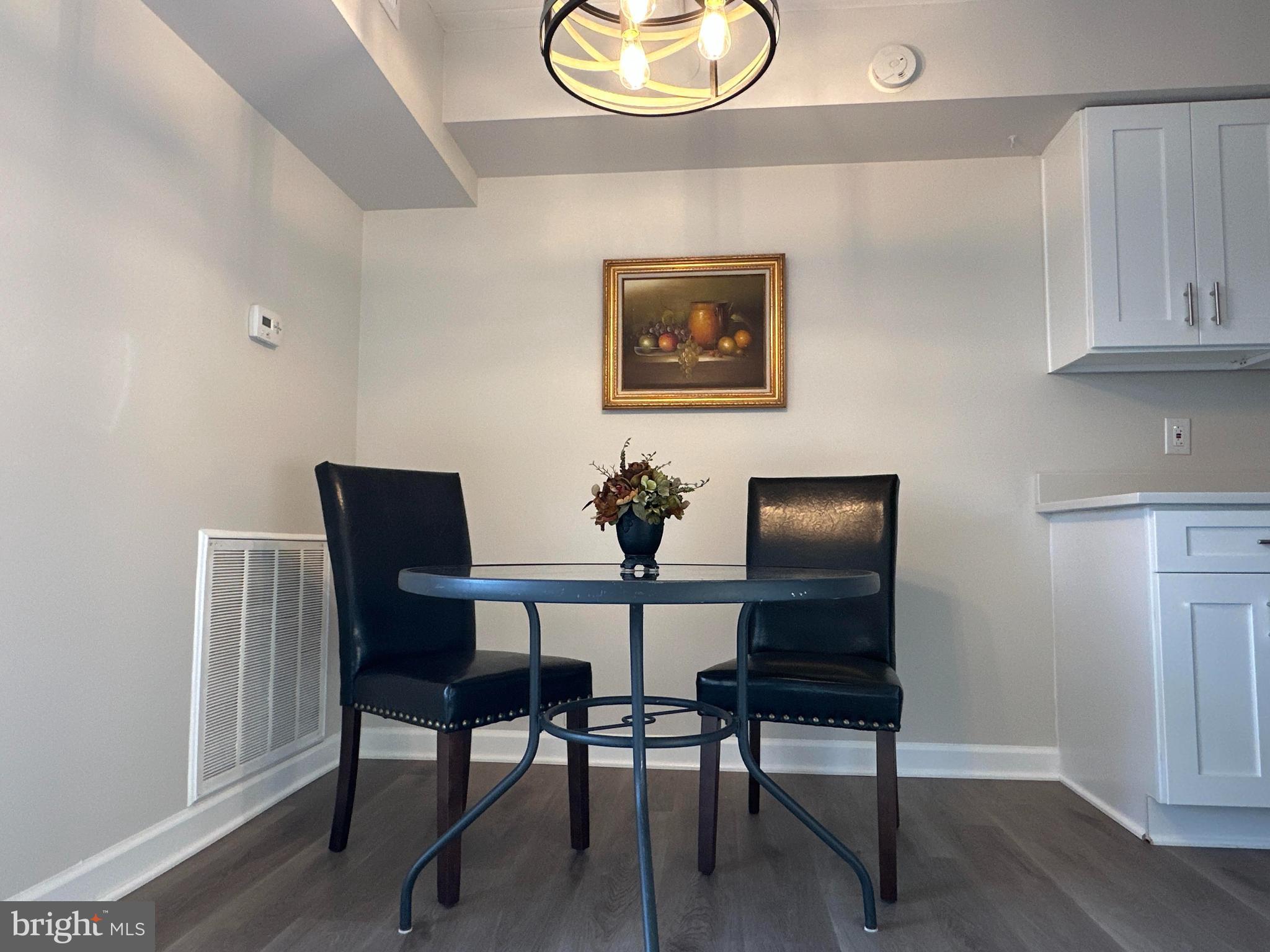 2317 Freetown Court, Unit 11C Reston, VA 20191 - Photo 5 of 21 a view of a dining room with furniture and wooden floor