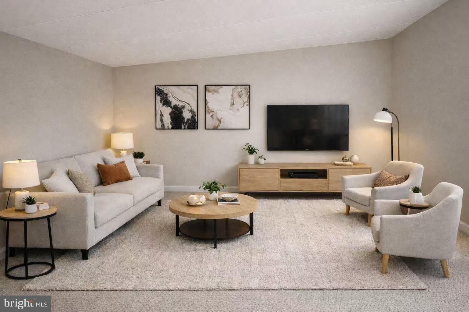 2317 Freetown Court, Unit 11C Reston, VA 20191 - Photo 6 of 21 a living room with furniture a flat screen tv and a couch