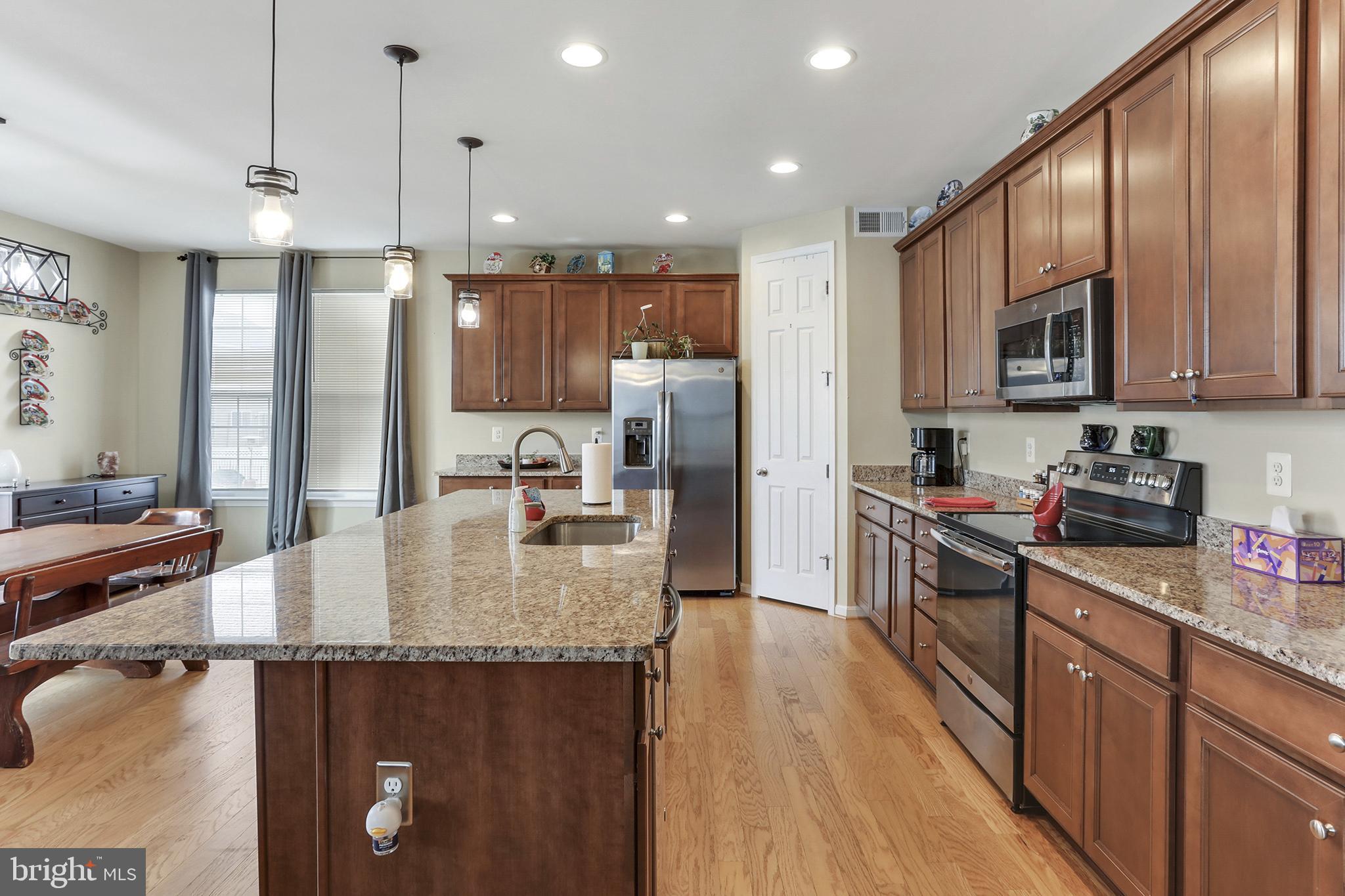 128 Sparkling Brook Road Ranson, WV 25438 - Photo 8 of 57 Upgraded kitchen with granite countertops