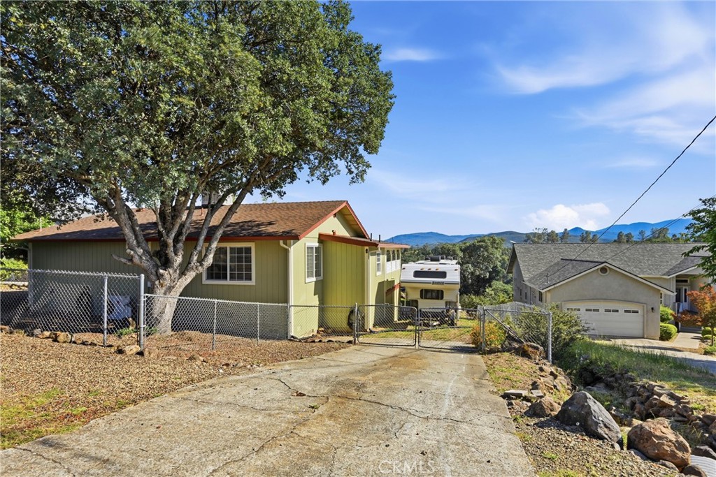 20257 Indian Rock Road Hidden Valley Lake, CA 95467 - Photo 32 of 33 RV area behind the gate has hook ups.
