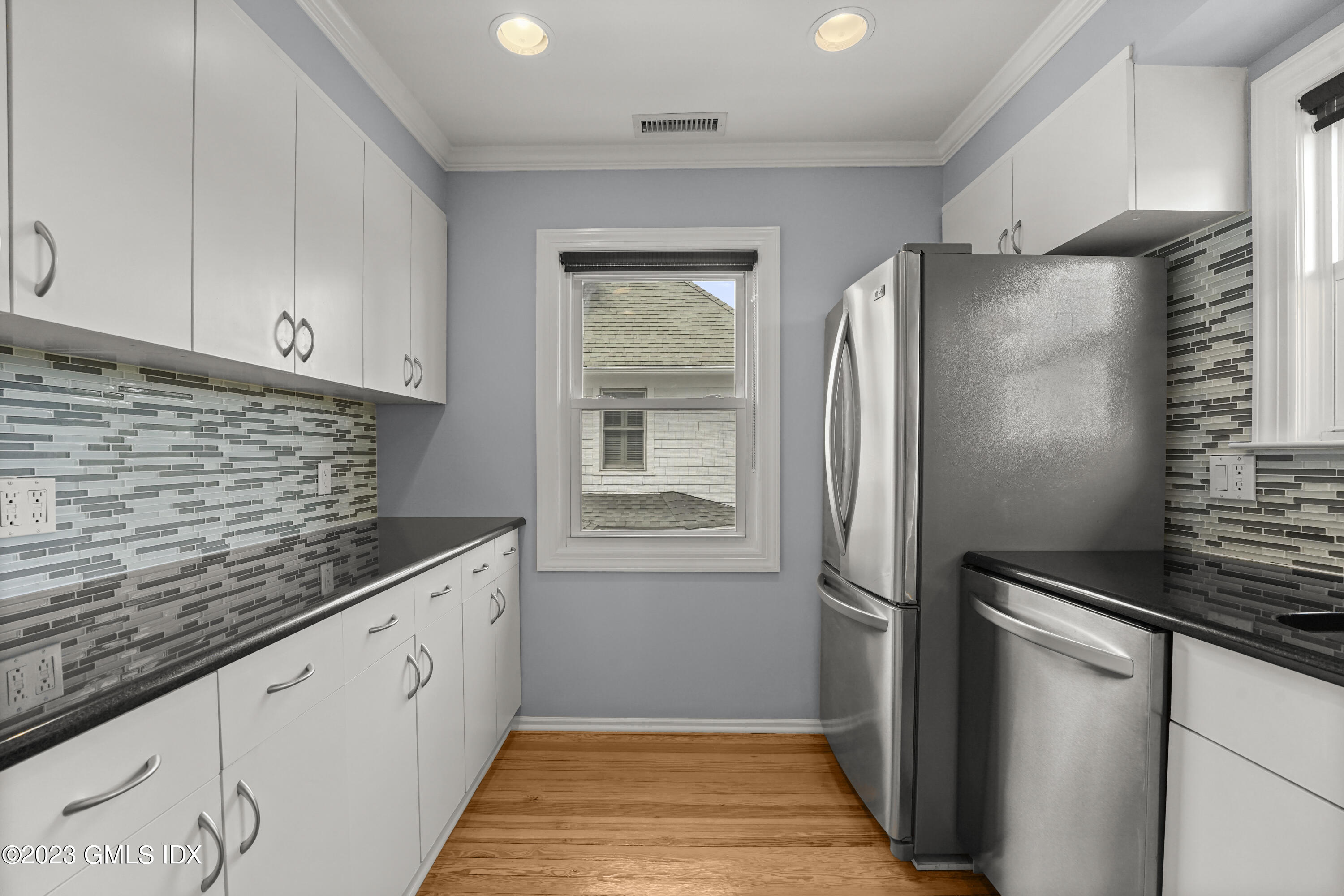 59 Ridge Street, Unit 2 Greenwich, CT 06830 - Photo 14 of 31 a kitchen with stainless steel appliances granite countertop a refrigerator and a sink