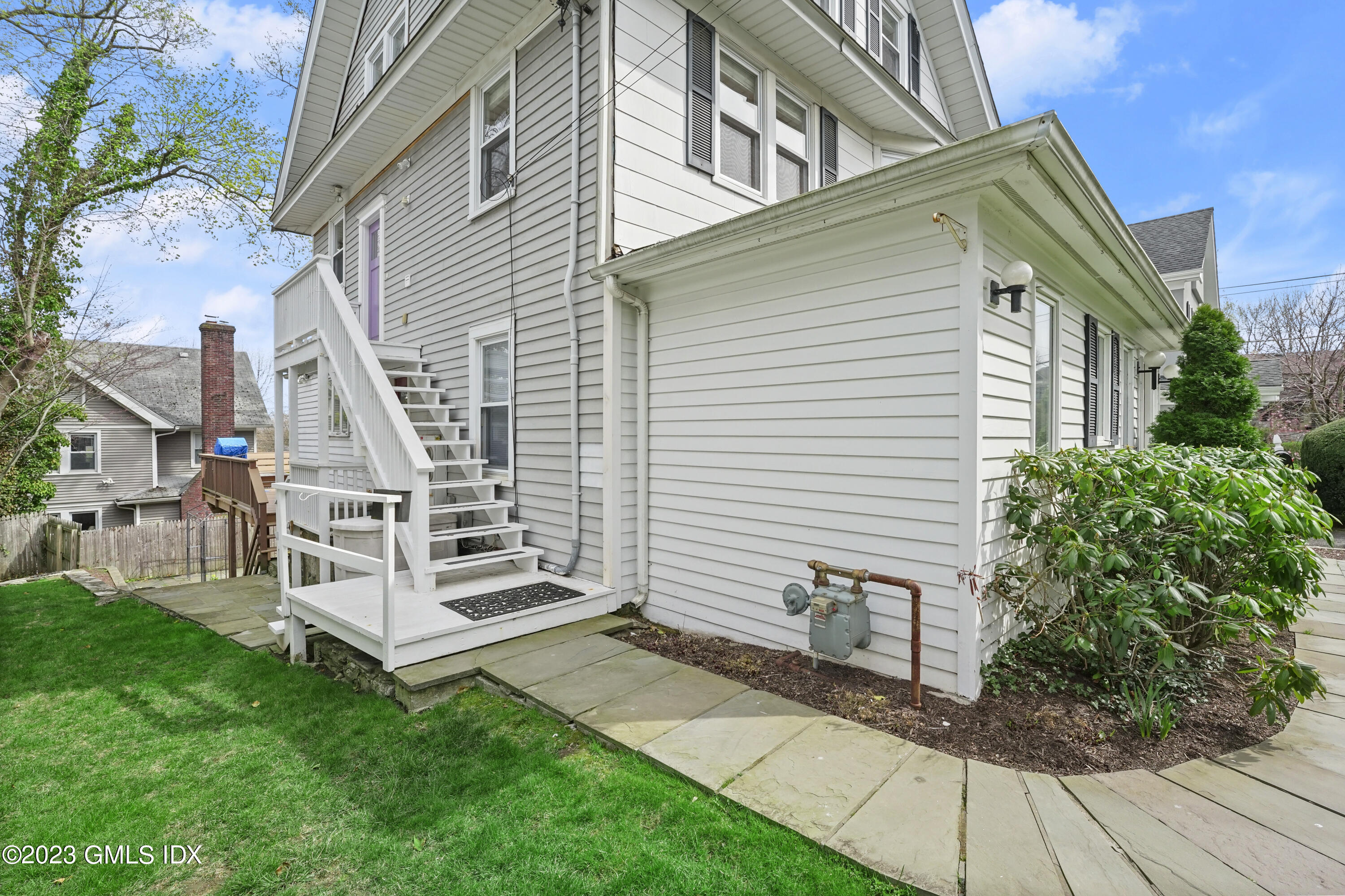 59 Ridge Street, Unit 2 Greenwich, CT 06830 - Photo 2 of 31 a view of a house with a yard