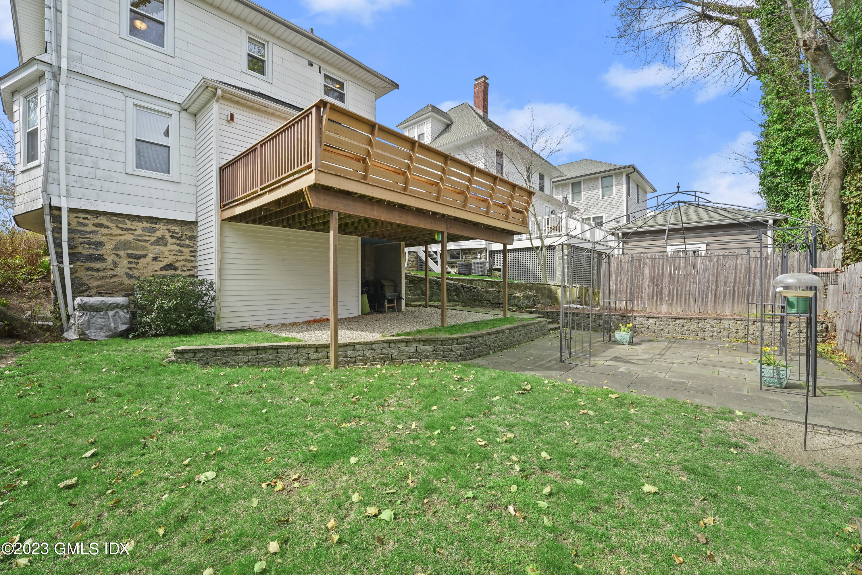 59 Ridge Street, Unit 2 Greenwich, CT 06830 - Photo 29 of 31 a view of a house with a yard