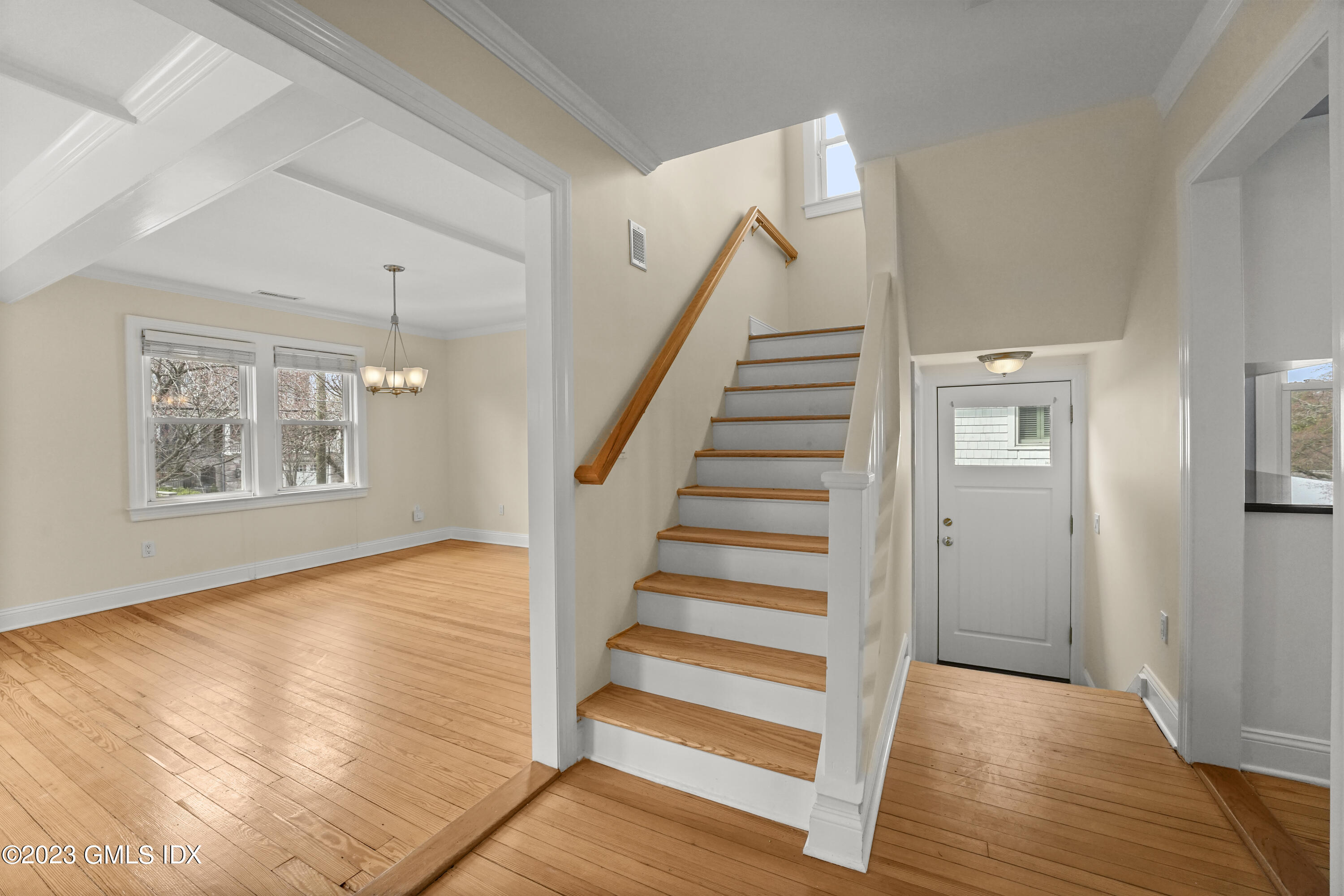 59 Ridge Street, Unit 2 Greenwich, CT 06830 - Photo 4 of 31 a view of entryway with wooden floor and stairs