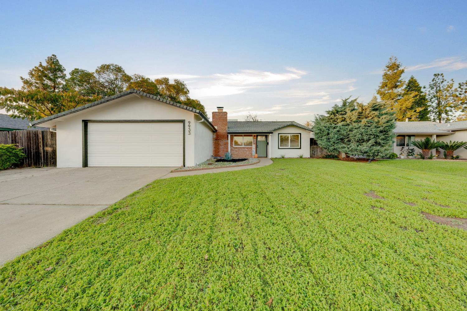9933 Nebula Way Sacramento, CA 95827 - Photo 1 of 1 a front view of a house with garden