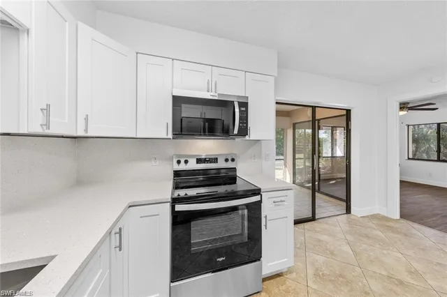 a kitchen with a stove and a microwave
