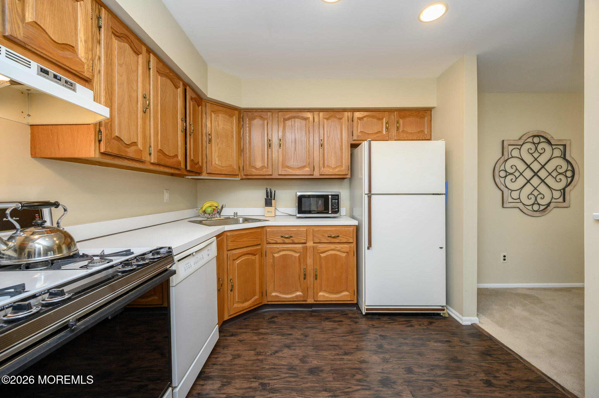 182 Edinburgh Court Matawan, NJ 07747 - Photo 12 of 24 a kitchen with granite countertop a refrigerator stove top oven and sink