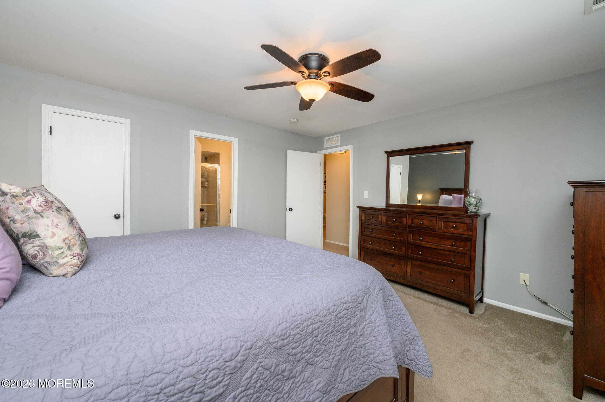 182 Edinburgh Court Matawan, NJ 07747 - Photo 18 of 24 a bedroom with a bed and a dresser