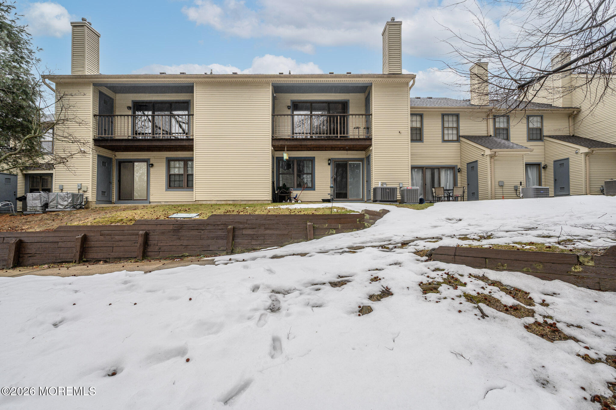 182 Edinburgh Court Matawan, NJ 07747 - Photo 24 of 24 a front view of residential houses with snow on the road