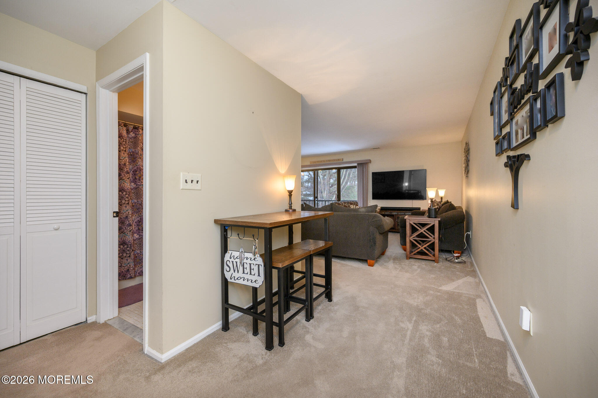 182 Edinburgh Court Matawan, NJ 07747 - Photo 4 of 24 a view of a livingroom with workspace and a window