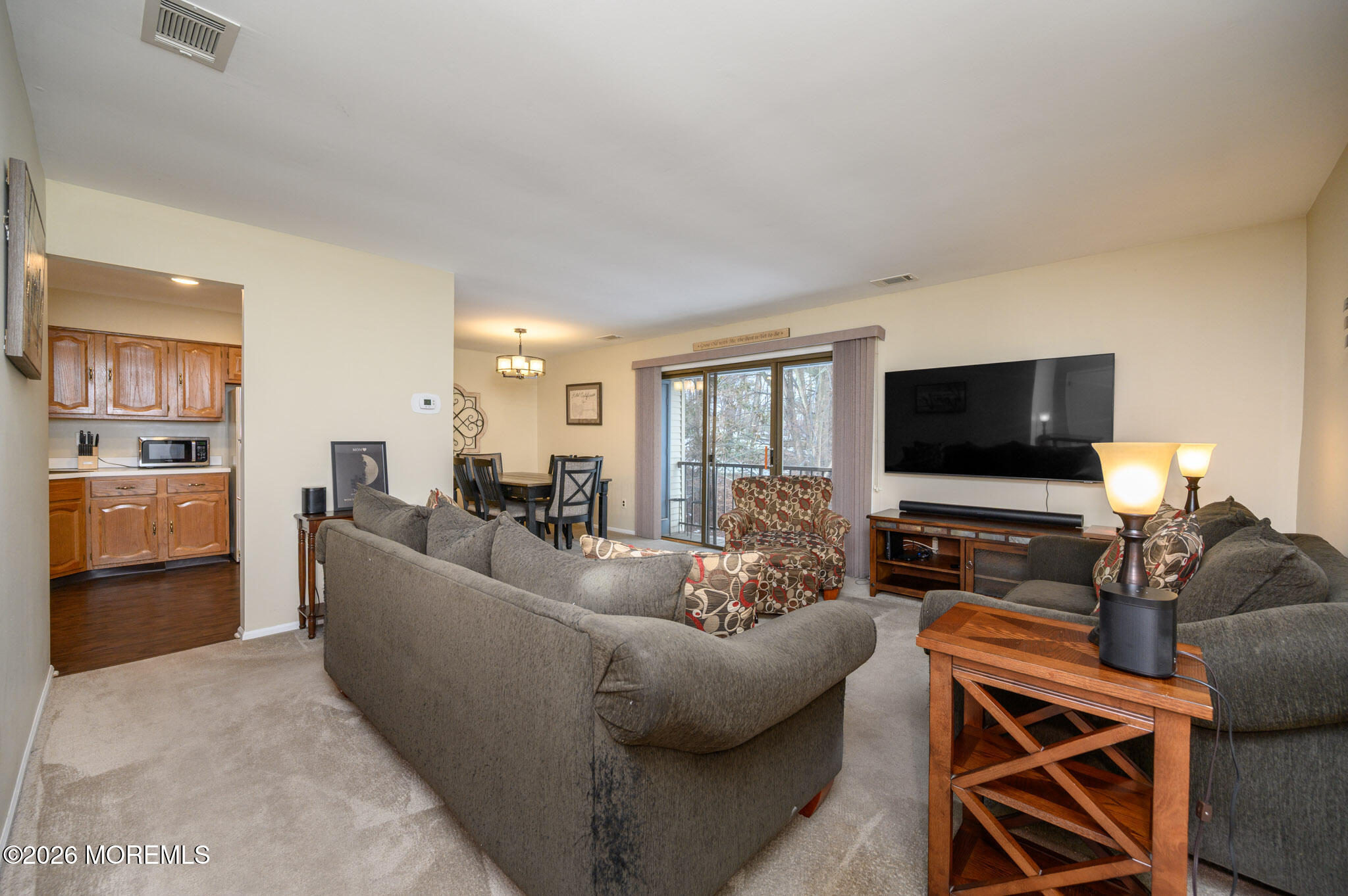 182 Edinburgh Court Matawan, NJ 07747 - Photo 5 of 24 a living room with furniture and a flat screen tv