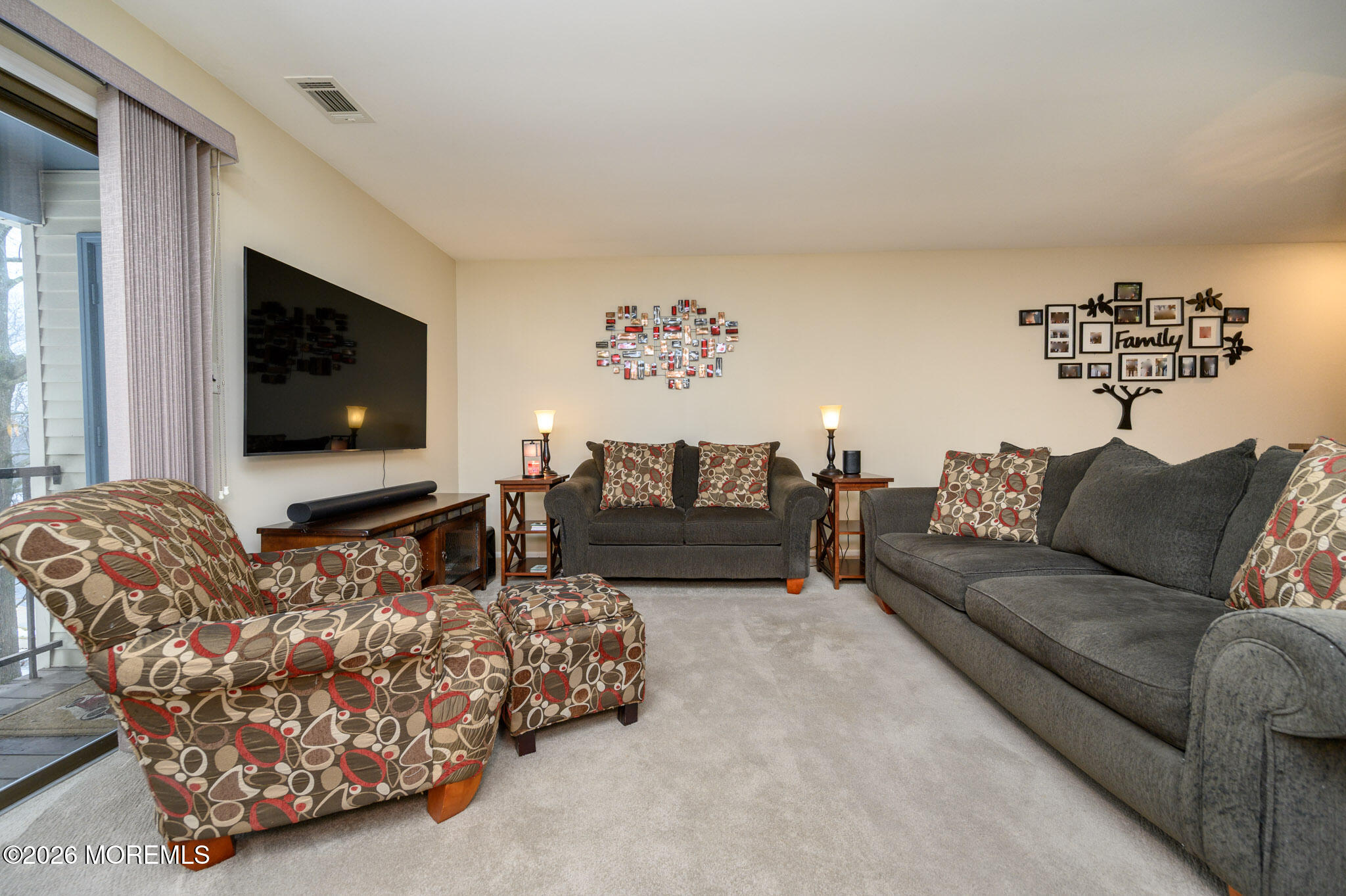 182 Edinburgh Court Matawan, NJ 07747 - Photo 6 of 24 a living room with furniture and a flat screen tv