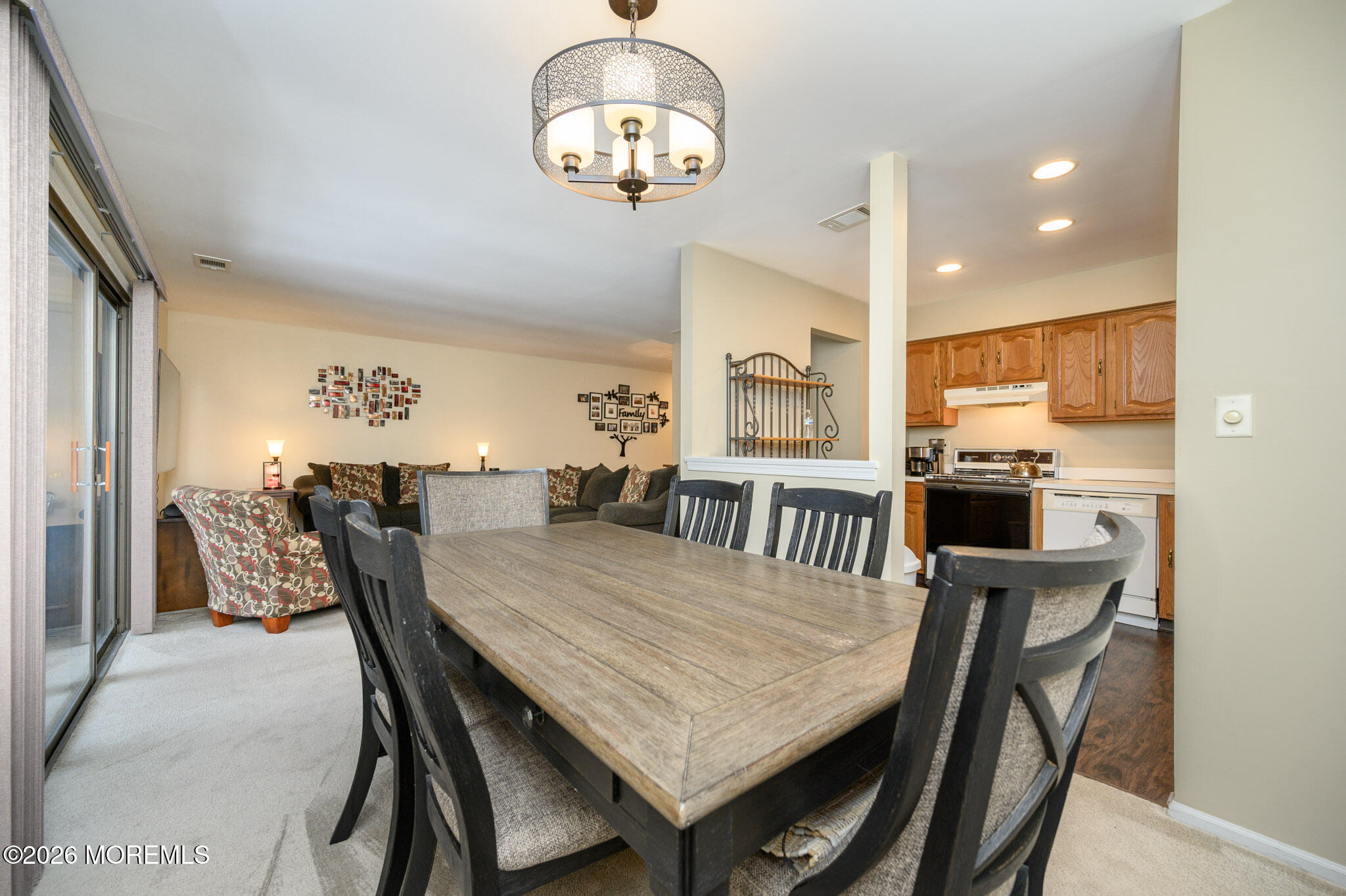 182 Edinburgh Court Matawan, NJ 07747 - Photo 9 of 24 a view of a dining room with furniture and a chandelier