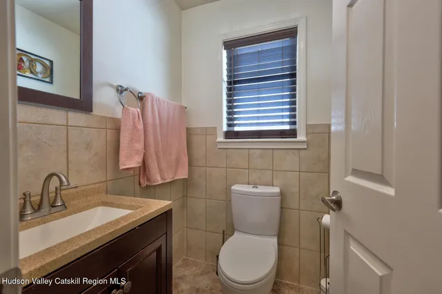 a bathroom with a toilet and a shower curtain