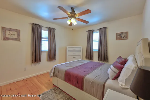 a bedroom with bed and a window