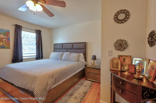 a living room with lots of furniture and a wooden floor