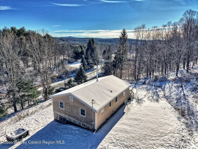 a view of a terrace with a bench in roof