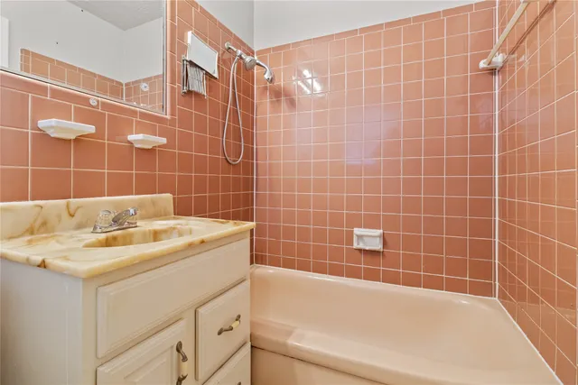 a bedroom with a bed and cabinets