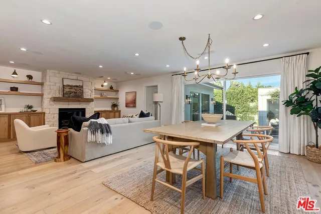 a view of a livingroom with furniture window and wooden floor