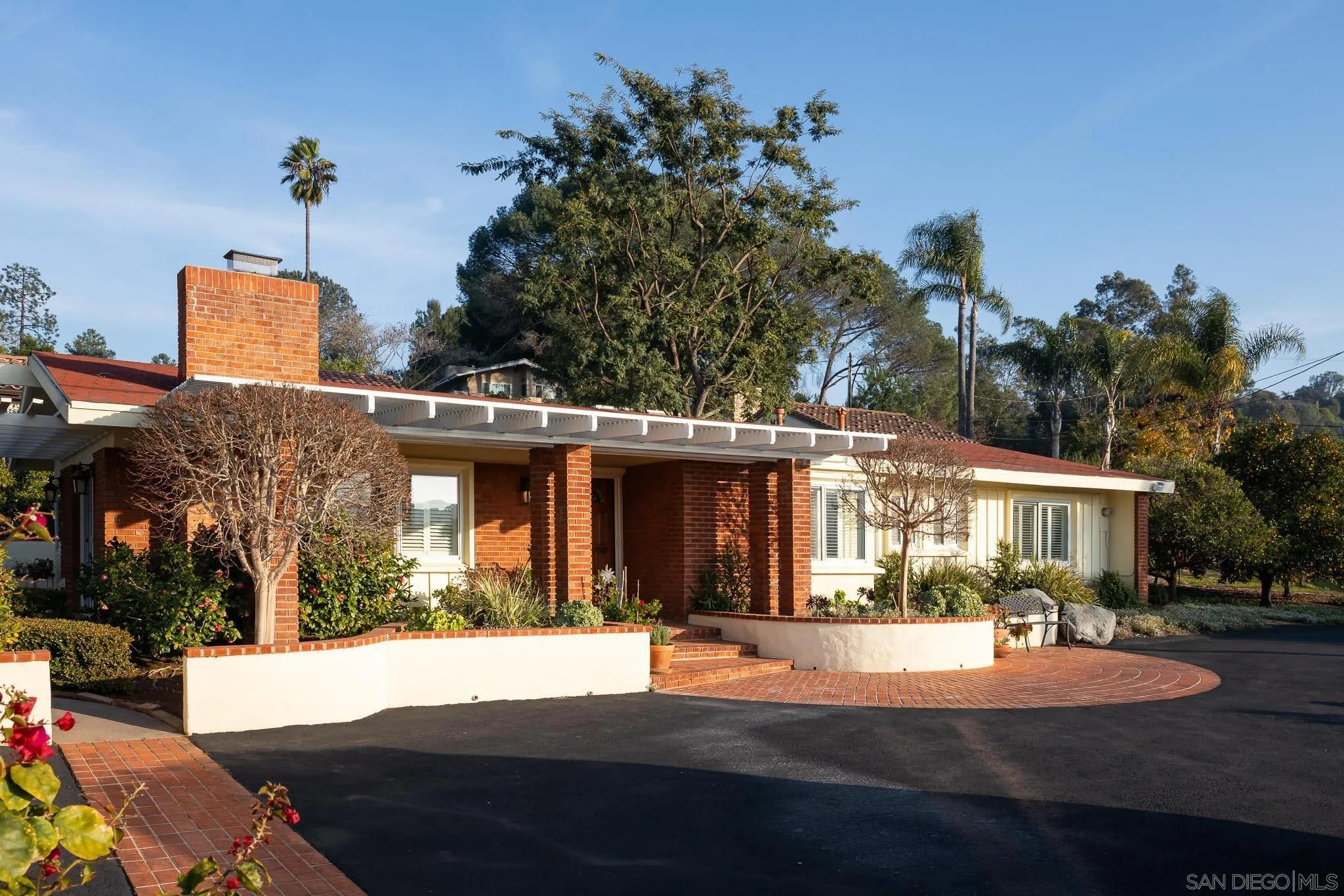 13404 Stone Canyon Road Poway, CA 92064 - Photo 3 of 42 a front view of a house with a yard
