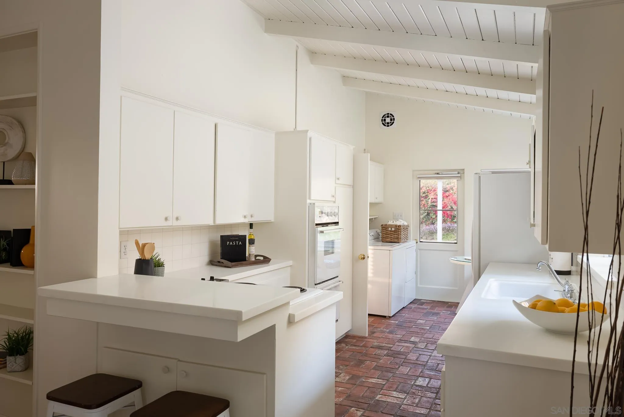 13404 Stone Canyon Road Poway, CA 92064 - Photo 10 of 42 a kitchen with a sink stove and refrigerator