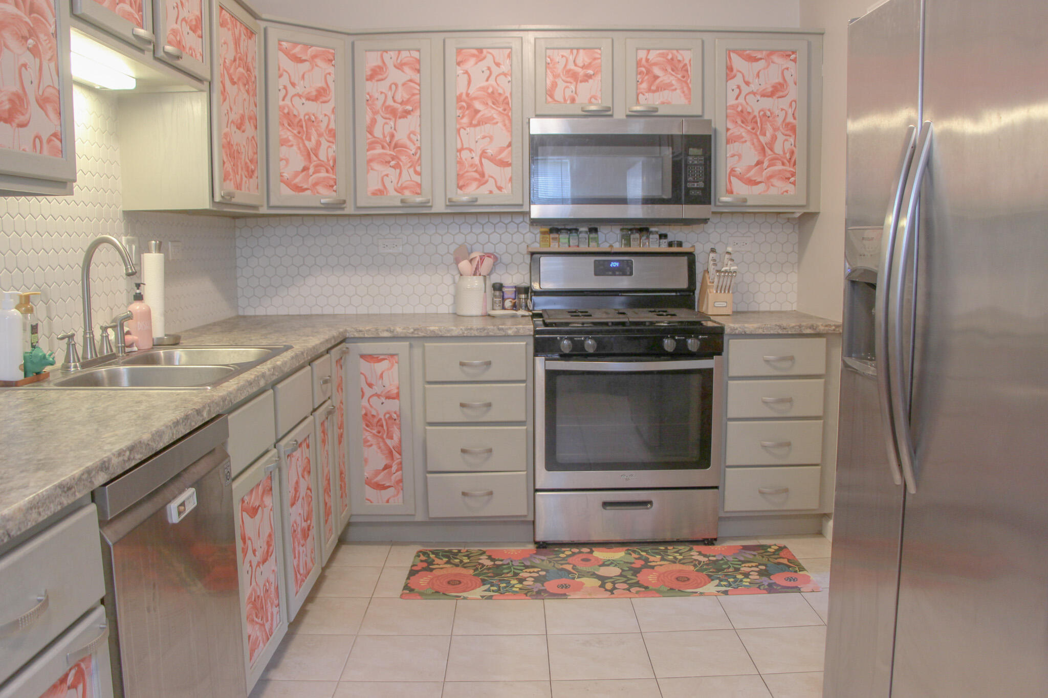 2819 Bryant Street Portage, IN 46368 - Photo 16 of 24 a kitchen with stainless steel appliances kitchen island granite countertop a sink stove and refrigerator