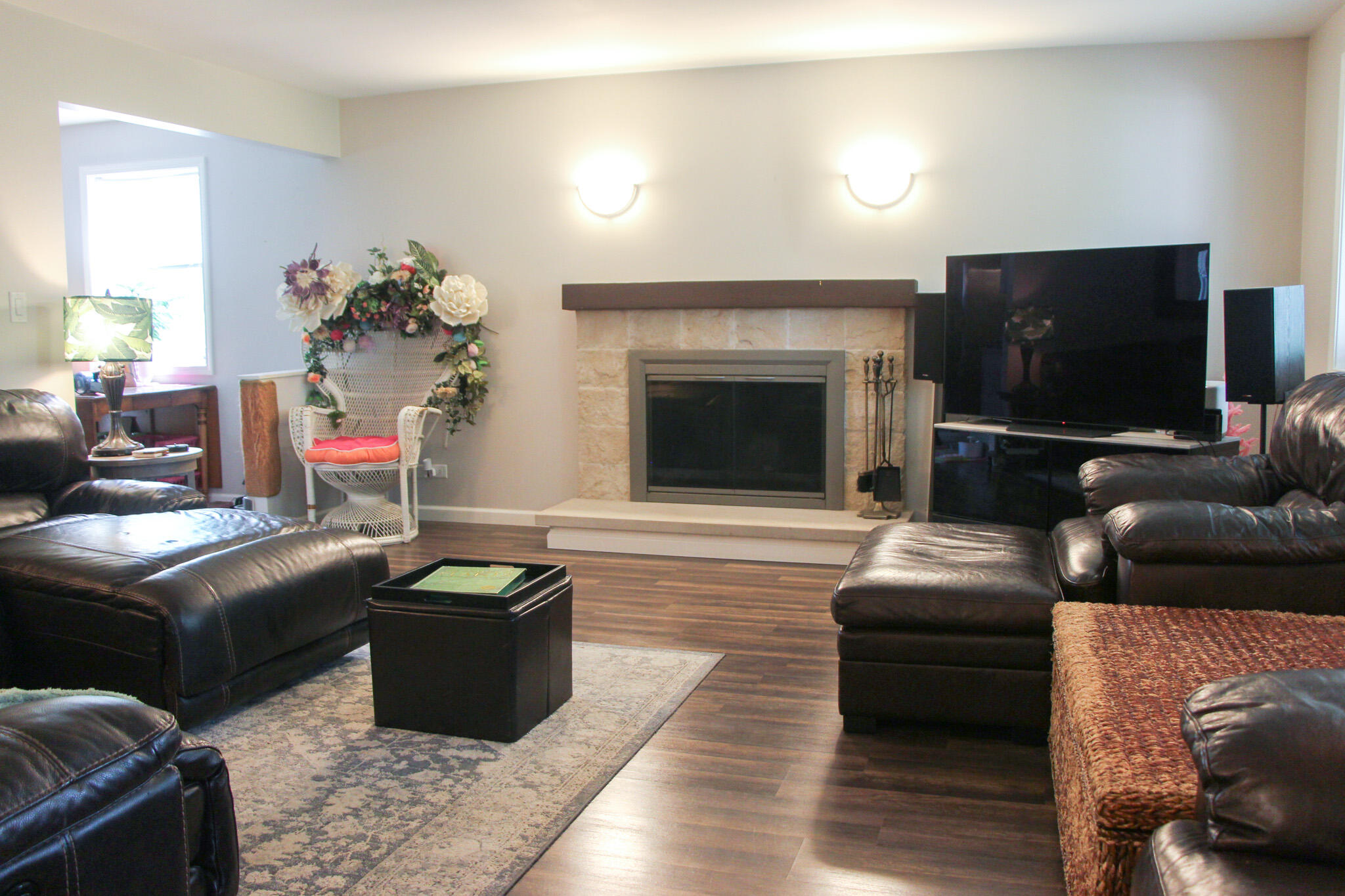 2819 Bryant Street Portage, IN 46368 - Photo 4 of 24 a living room with furniture a flat screen tv and a fireplace