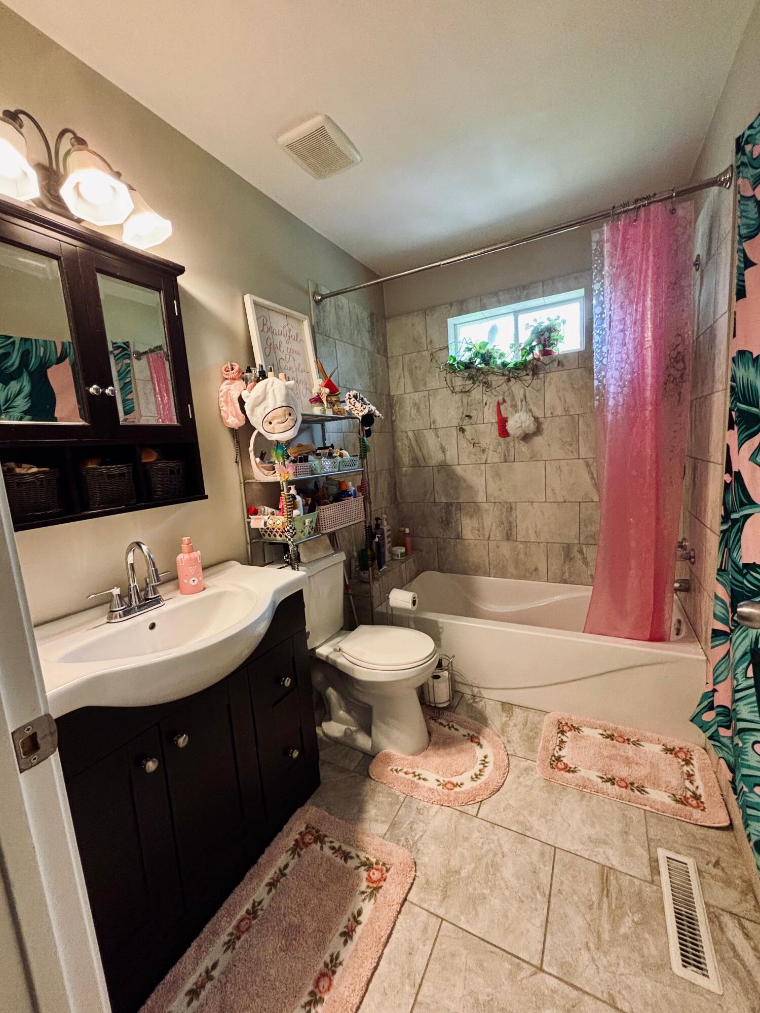 2819 Bryant Street Portage, IN 46368 - Photo 8 of 24 a bathroom with a sink toilet and shower