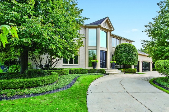 1536 Voltz Road Northbrook, IL 60062 - Photo 1 of 50 a front view of a house with a yard and trees