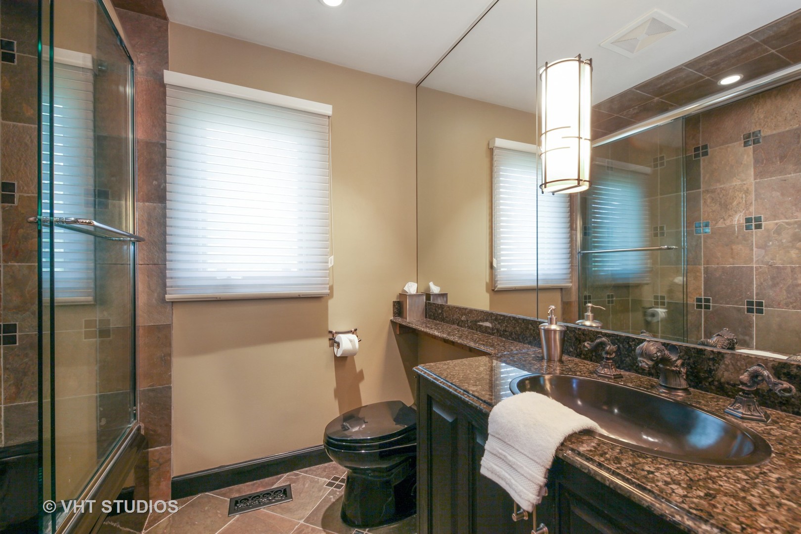 1536 Voltz Road Northbrook, IL 60062 - Photo 27 of 50 a bathroom with a granite countertop sink a toilet a mirror and shower