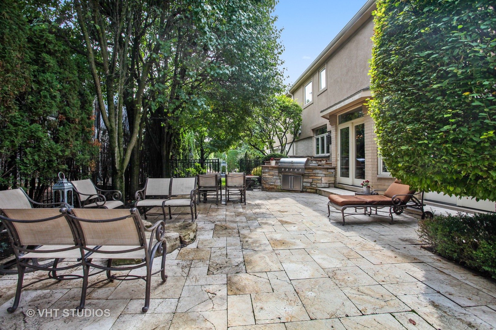 1536 Voltz Road Northbrook, IL 60062 - Photo 33 of 50 a view of a patio with table and chairs potted plants and large tree