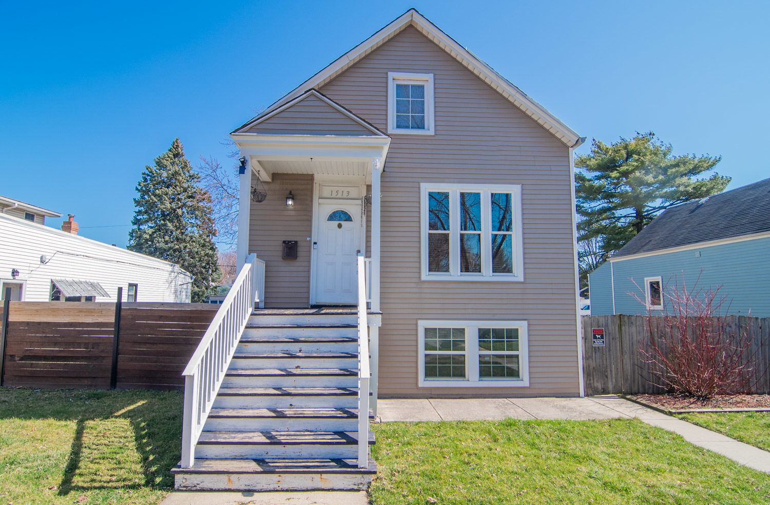 1513 Clinton Avenue Berwyn, IL 60402 - Photo 1 of 15 a front view of a house with a yard